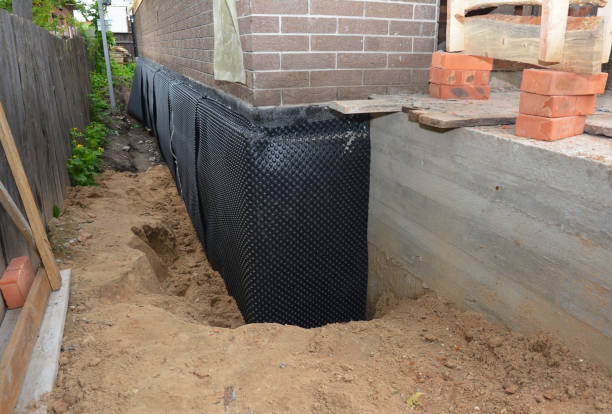 Happy homeowners after waterproofing job in Galloway